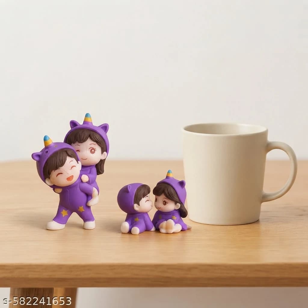 Set of two cute couple miniatures resting alongside a coffee mug for size comparison.